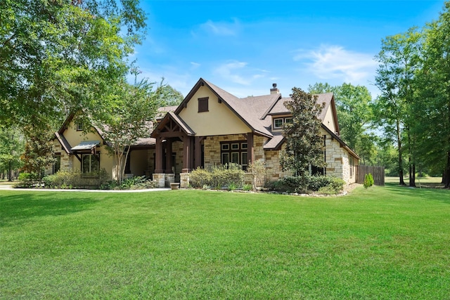 11399 Fm-3126, Livingston, TX 77351 - view of front of property featuring stone siding, a front yard, a chimney, and stucco siding