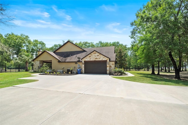 11399 Fm-3126, Livingston, TX 77351 - view of front facade featuring stone siding, concrete driveway, an attached garage, and stucco siding