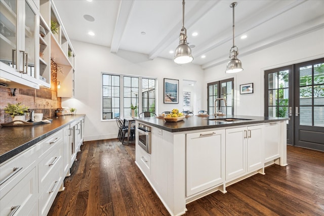 523 E 23rd St, Houston, TX 77008 - kitchen with dark countertops, beamed ceiling, dark wood-style floors, recessed lighting, and decorative backsplash