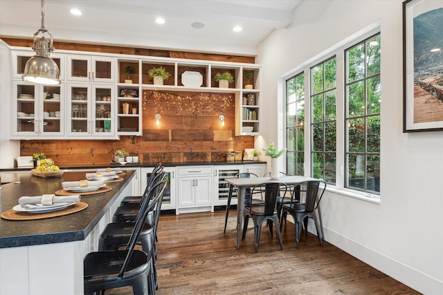 523 E 23rd St, Houston, TX 77008 - kitchen with dark countertops, white cabinets, open shelves, hanging light fixtures, and dark wood-style floors