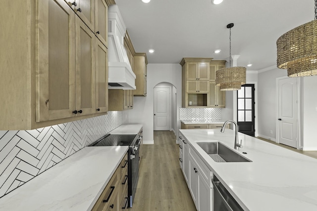 15408 Sandtrap Dr, Waller, TX 77484 - kitchen with stainless steel electric stove, recessed lighting, decorative backsplash, light stone counters, and light wood-type flooring