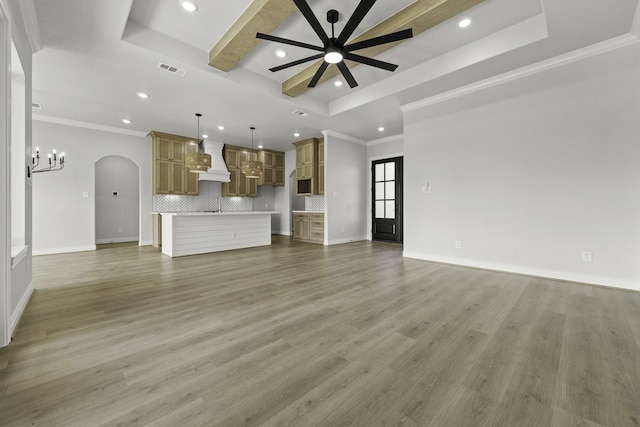 15408 Sandtrap Dr, Waller, TX 77484 - unfurnished living room with recessed lighting, a chandelier, arched walkways, ceiling fan, and ornamental molding