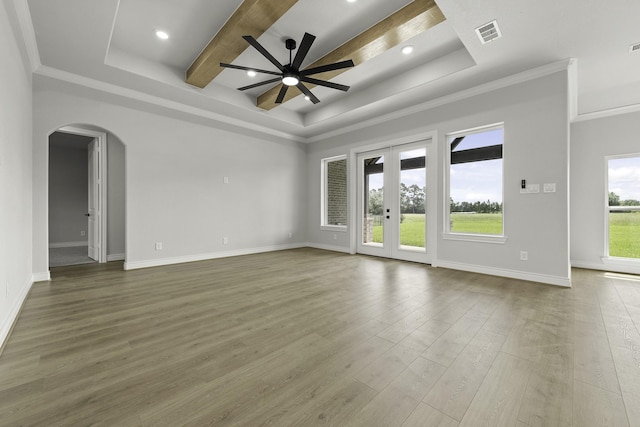 15408 Sandtrap Dr, Waller, TX 77484 - unfurnished room featuring a tray ceiling, arched walkways, wood finished floors, a ceiling fan, and crown molding