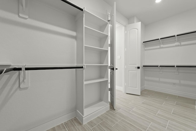 15408 Sandtrap Dr, Waller, TX 77484 - spacious closet with wood tiled floors