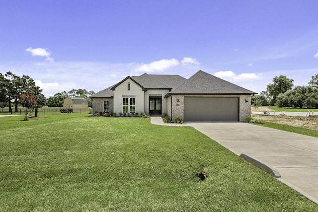 15408 Sandtrap Dr, Waller, TX 77484 - french country home featuring a garage, concrete driveway, roof with shingles, and brick siding