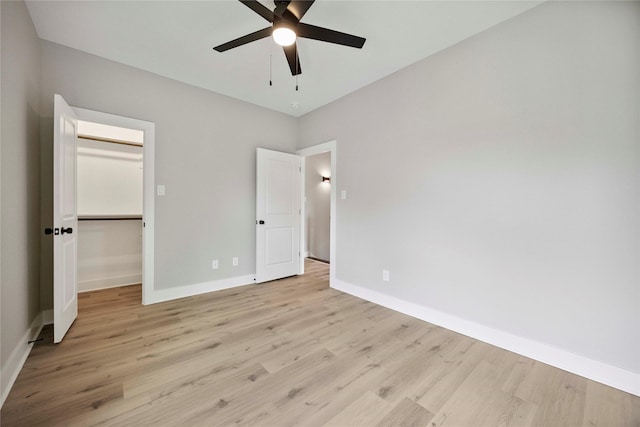 217 Pheasant St, Houston, TX 77018 - unfurnished bedroom with light wood finished floors, a spacious closet, and ceiling fan