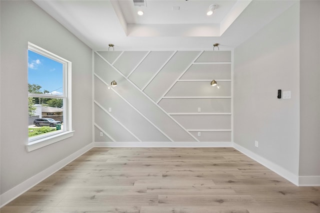 217 Pheasant St, Houston, TX 77018 - spare room featuring light wood-style flooring and a tray ceiling