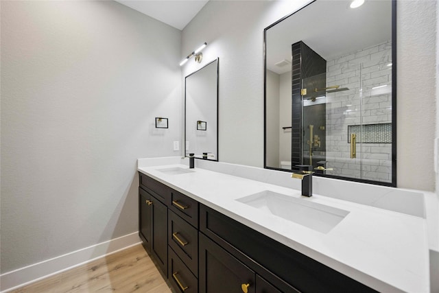 217 Pheasant St, Houston, TX 77018 - full bath featuring double vanity, a stall shower, and wood finished floors