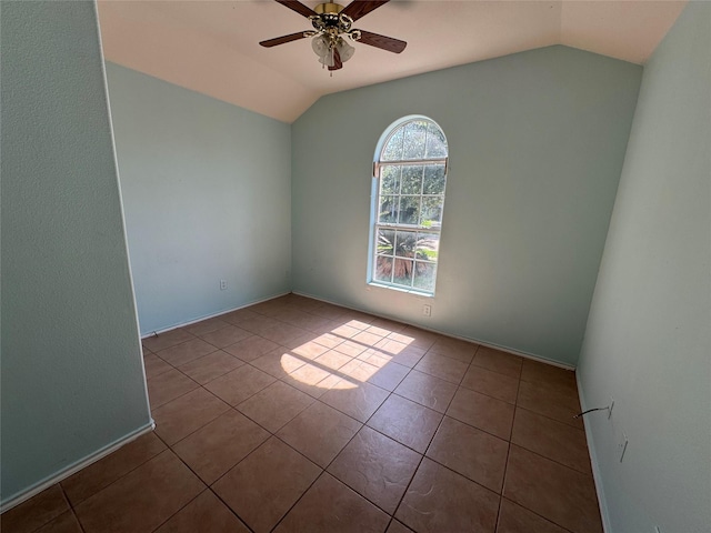 5518 Rio Ramos St, Rosharon, TX 77583 - spare room with vaulted ceiling, ceiling fan, and tile patterned flooring