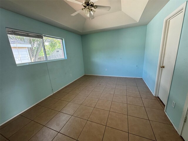 5518 Rio Ramos St, Rosharon, TX 77583 - spare room with tile patterned floors, ceiling fan, and a raised ceiling