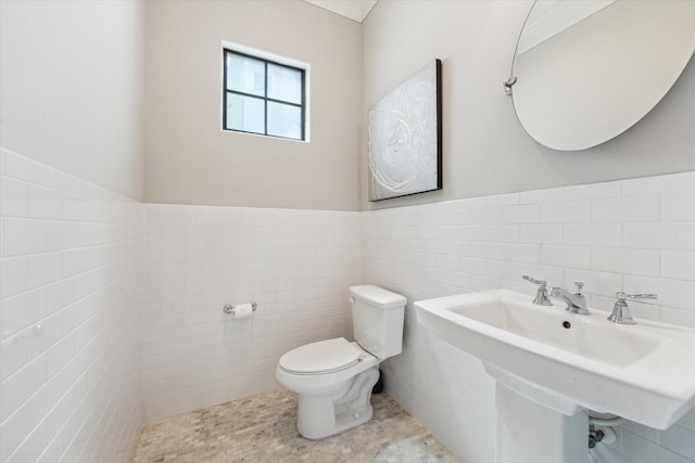 521 W Bell St, Houston, TX 77019 - half bath with tile walls and a wainscoted wall
