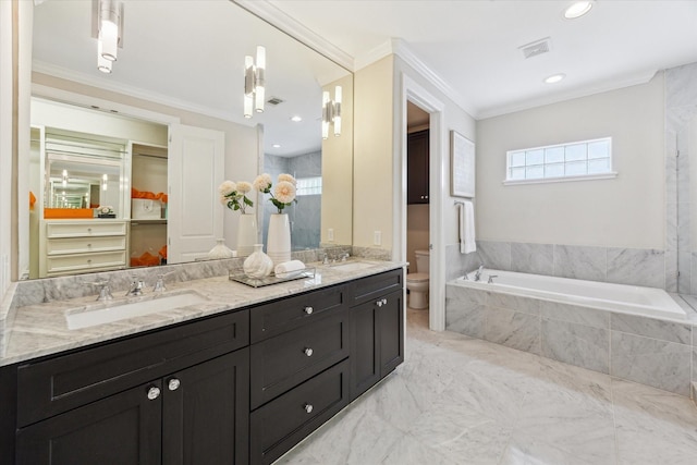521 W Bell St, Houston, TX 77019 - bathroom featuring a garden tub, double vanity, ornamental molding, and marble finish flooring