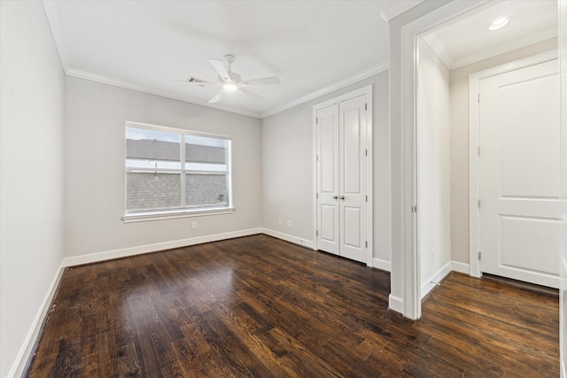 521 W Bell St, Houston, TX 77019 - unfurnished bedroom with crown molding, dark wood-style flooring, a closet, and ceiling fan