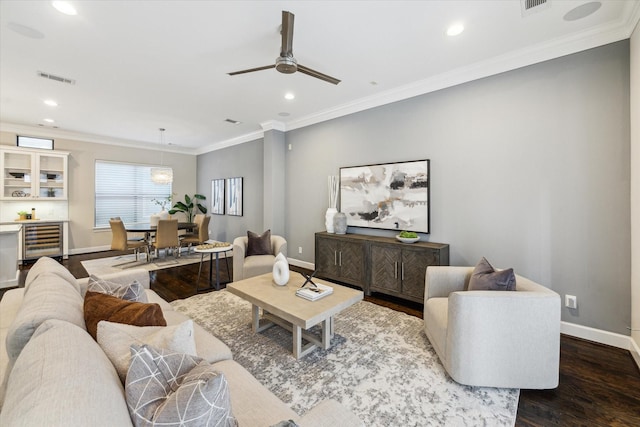 521 W Bell St, Houston, TX 77019 - living area featuring dark wood-style floors, wine cooler, recessed lighting, a ceiling fan, and ornamental molding