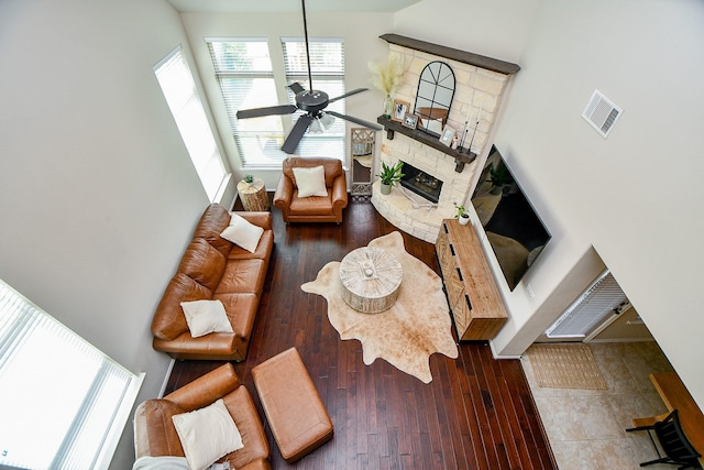 29011 Oldfield Ct, Katy, TX 77494 - living room with a fireplace, a ceiling fan, healthy amount of natural light, a high ceiling, and hardwood / wood-style floors