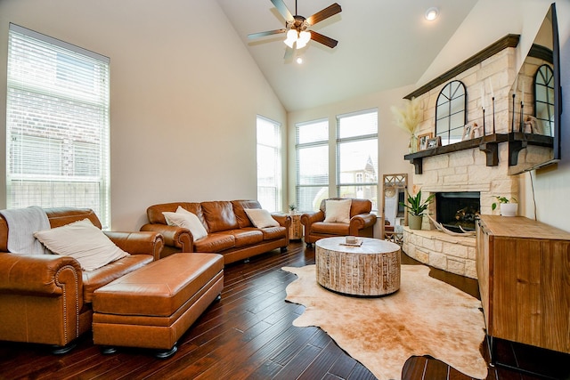 29011 Oldfield Ct, Katy, TX 77494 - living room with high vaulted ceiling, ceiling fan, a stone fireplace, dark wood-style floors, and healthy amount of natural light
