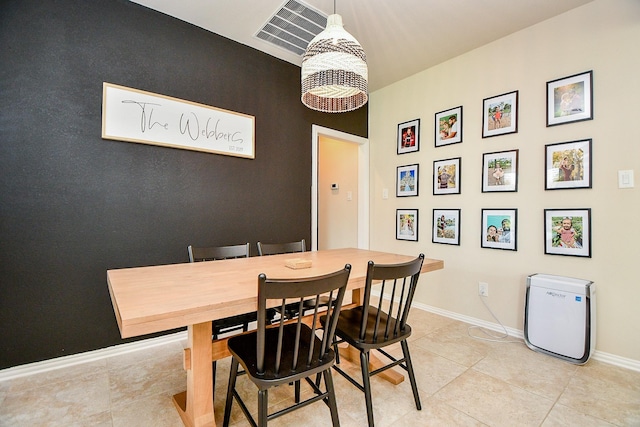 29011 Oldfield Ct, Katy, TX 77494 - dining area featuring light tile patterned flooring and an accent wall