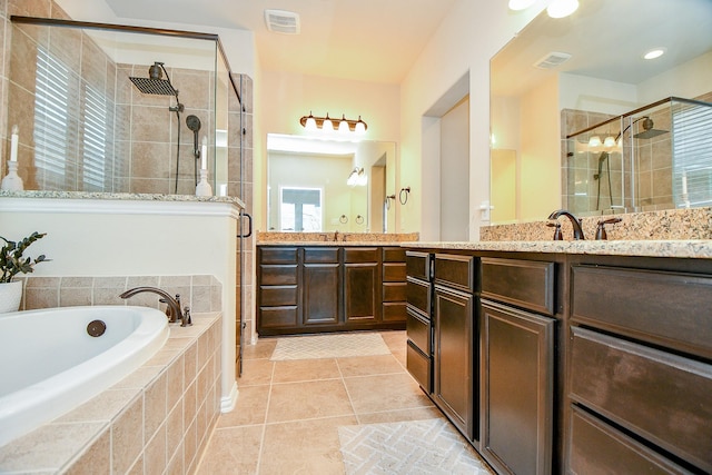 29011 Oldfield Ct, Katy, TX 77494 - bathroom with a stall shower, a garden tub, vanity, and tile patterned floors