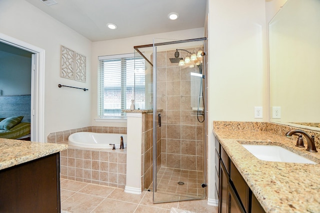 29011 Oldfield Ct, Katy, TX 77494 - bathroom with vanity, a garden tub, a shower stall, tile patterned flooring, and recessed lighting