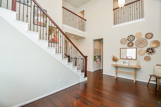 29011 Oldfield Ct, Katy, TX 77494 - staircase featuring a towering ceiling and wood-type flooring