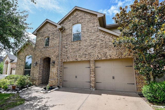 29011 Oldfield Ct, Katy, TX 77494 - french country inspired facade with brick siding, driveway, and a garage