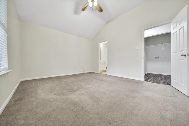 11703 Elizabeth Ct, Pinehurst, TX 77362 - unfurnished bedroom featuring carpet floors, lofted ceiling, connected bathroom, a walk in closet, and ceiling fan