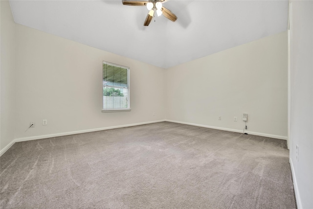 11703 Elizabeth Ct, Pinehurst, TX 77362 - empty room featuring a ceiling fan, carpet, and vaulted ceiling