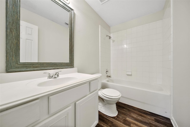 11703 Elizabeth Ct, Pinehurst, TX 77362 - bathroom with vanity, wood finished floors, and shower / washtub combination