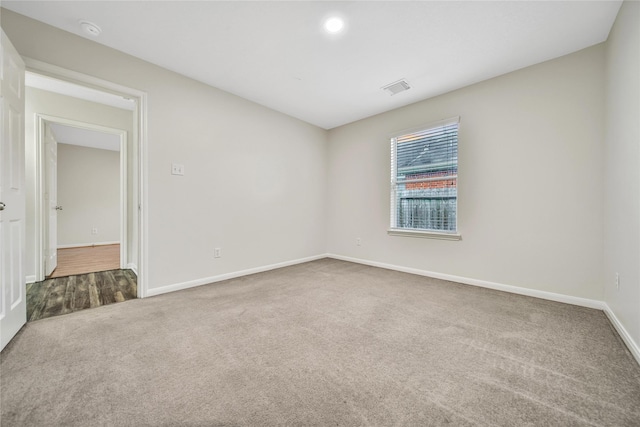 11703 Elizabeth Ct, Pinehurst, TX 77362 - empty room with carpet floors and a smoke detector