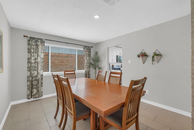 19702 Franz Rd, Houston, TX 77084 - dining space featuring light tile patterned floors and recessed lighting