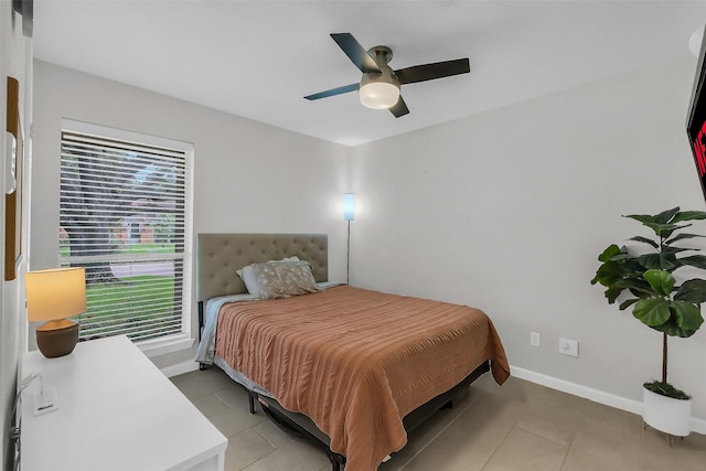 19702 Franz Rd, Houston, TX 77084 - bedroom featuring light tile patterned floors and ceiling fan