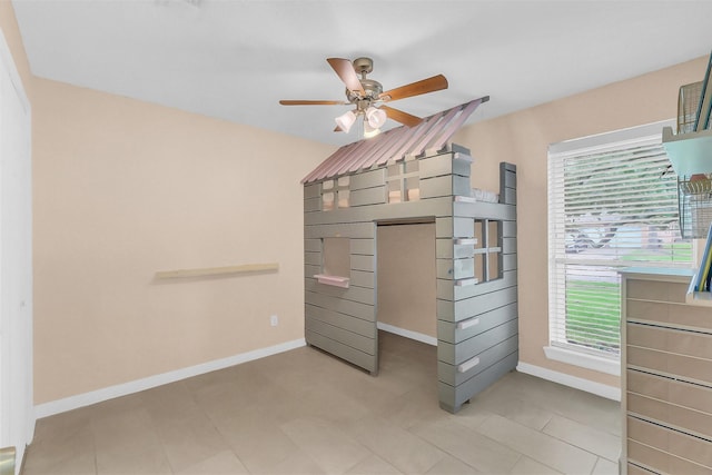 19702 Franz Rd, Houston, TX 77084 - unfurnished bedroom featuring baseboards and ceiling fan