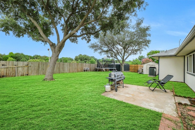 19702 Franz Rd, Houston, TX 77084 - fenced backyard with a trampoline, a shed, and a patio area