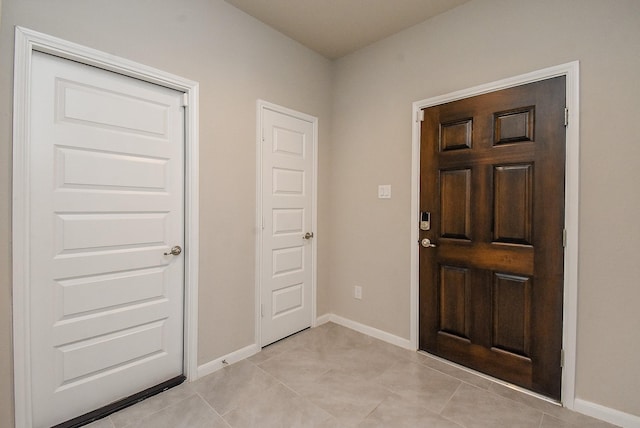 5602 Cedar Crescent Ct, Richmond, TX 77407 - foyer featuring baseboards and light tile patterned flooring