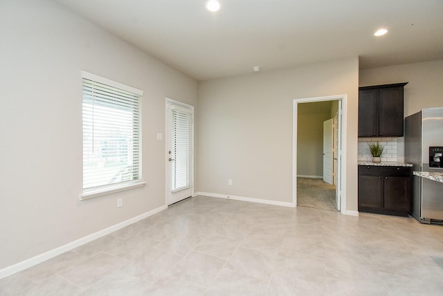 5602 Cedar Crescent Ct, Richmond, TX 77407 - unfurnished living room featuring recessed lighting and light tile patterned floors