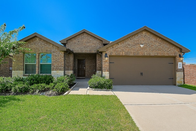 5602 Cedar Crescent Ct, Richmond, TX 77407 - french country home featuring brick siding, a garage, a front lawn, driveway, and stone siding