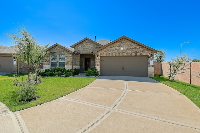 5602 Cedar Crescent Ct, Richmond, TX 77407 - french country style house with an attached garage, concrete driveway, and brick siding