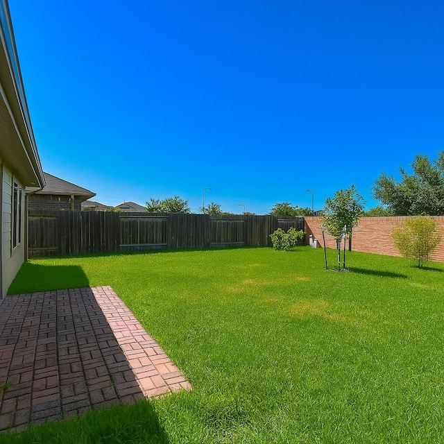 5602 Cedar Crescent Ct, Richmond, TX 77407 - fenced backyard with a patio area