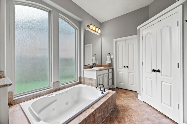 27410 Villa Mountain Ct, Fulshear, TX 77441 - full bathroom featuring a jetted tub, a closet, and vanity