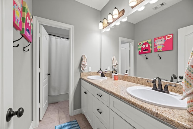 27410 Villa Mountain Ct, Fulshear, TX 77441 - bathroom featuring double vanity, tile patterned floors, and a shower with shower curtain