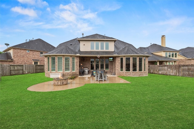 27410 Villa Mountain Ct, Fulshear, TX 77441 - rear view of property featuring a fenced backyard, brick siding, and a patio area
