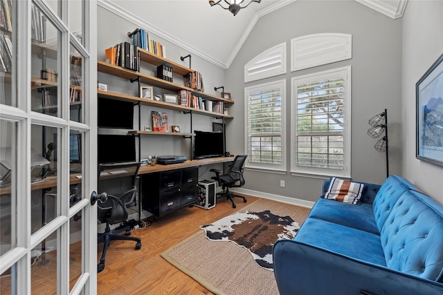 27410 Villa Mountain Ct, Fulshear, TX 77441 - home office with crown molding, vaulted ceiling, light wood-style floors, and built in desk