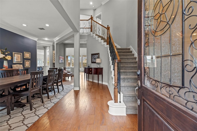 27410 Villa Mountain Ct, Fulshear, TX 77441 - entryway with hardwood / wood-style flooring, ornamental molding, stairs, and recessed lighting