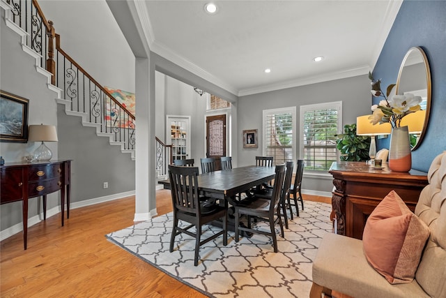 27410 Villa Mountain Ct, Fulshear, TX 77441 - dining area with light wood finished floors, stairway, ornamental molding, and recessed lighting
