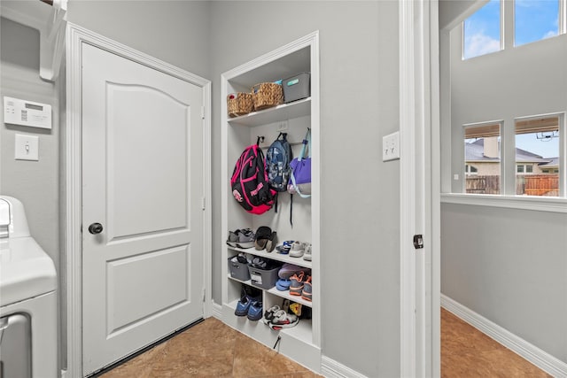 27410 Villa Mountain Ct, Fulshear, TX 77441 - mudroom featuring washer / clothes dryer, tile patterned floors, and plenty of natural light