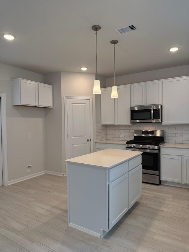 8116 Tourmaline Way, Texas City, TX 77591 - kitchen featuring stainless steel appliances, light wood-style floors, recessed lighting, light countertops, and tasteful backsplash