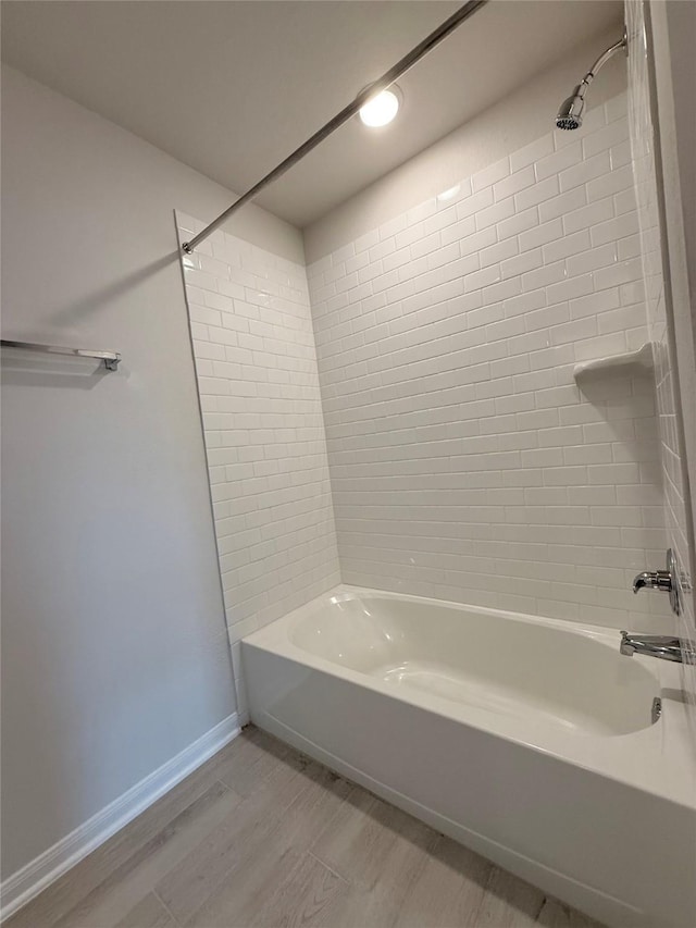 8116 Tourmaline Way, Texas City, TX 77591 - bathroom with bathing tub / shower combination and wood finished floors