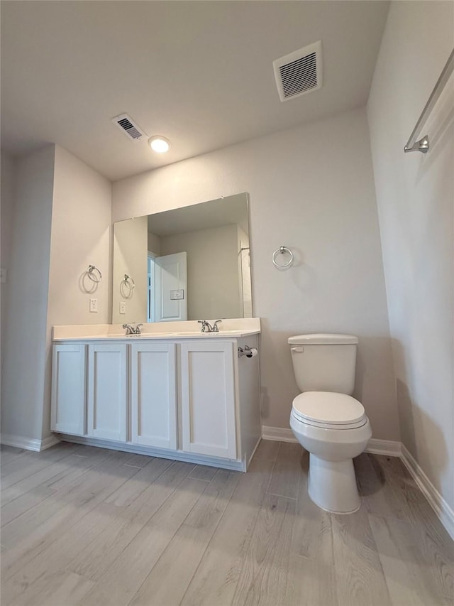 8116 Tourmaline Way, Texas City, TX 77591 - bathroom featuring double vanity and wood finished floors