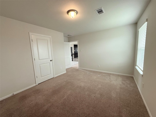 8116 Tourmaline Way, Texas City, TX 77591 - spare room featuring healthy amount of natural light and light colored carpet