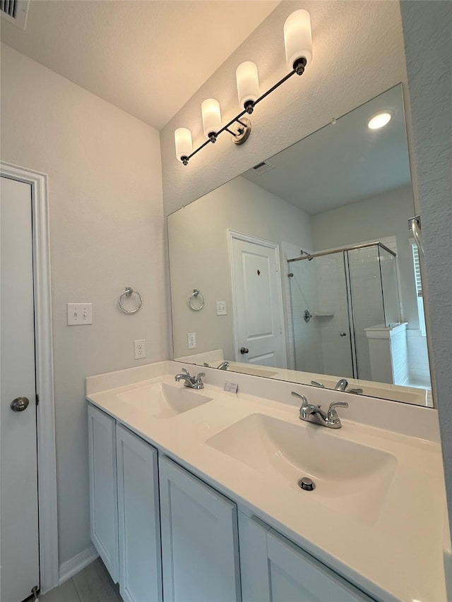 8116 Tourmaline Way, Texas City, TX 77591 - full bath featuring a shower stall and double vanity